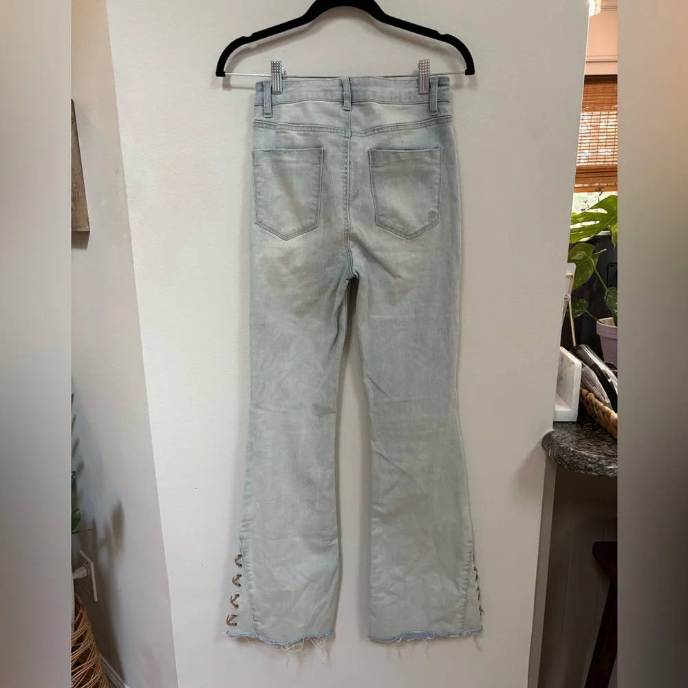 Indigo Rain bell bottoms with leather braided accent, size 5